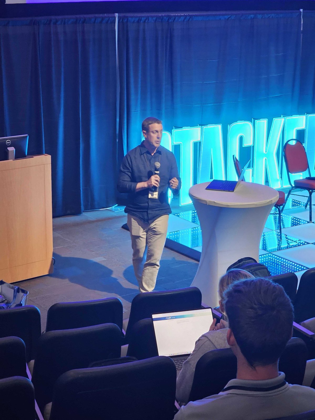 Jon Cheney speaking to a room at STACKED